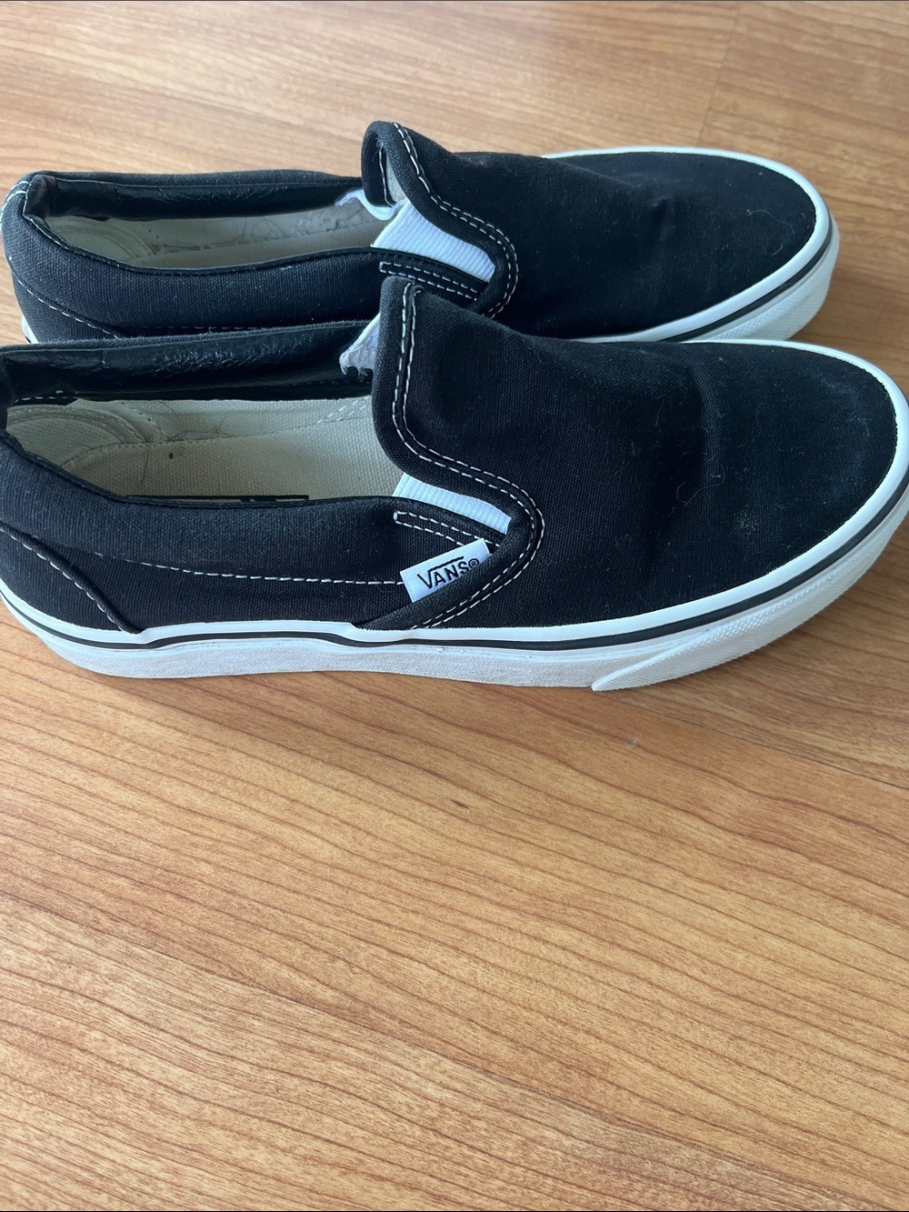 Vans Black and White Slip-On Canvas Sneakers